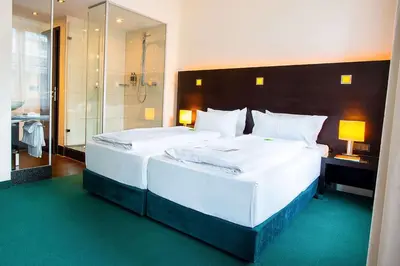 Ein Bett oder Betten in einem Zimmer der Unterkunft Flemings Hotel München-City