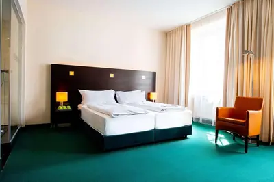 Ein Bett oder Betten in einem Zimmer der Unterkunft Flemings Hotel München-City