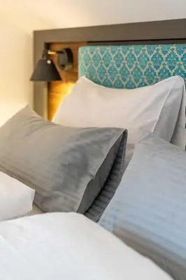 Ein Bett oder Betten in einem Zimmer der Unterkunft Klosterbräu Schlehdorf