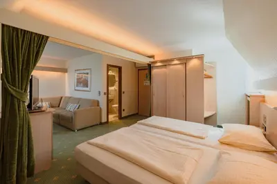 Ein Bett oder Betten in einem Zimmer der Unterkunft Parkhotel Crombach