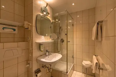 Ein Badezimmer in der Unterkunft Parkhotel Crombach