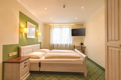 Ein Bett oder Betten in einem Zimmer der Unterkunft Parkhotel Crombach