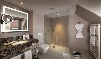 Ein Badezimmer in der Unterkunft Hotel Maximilian’s