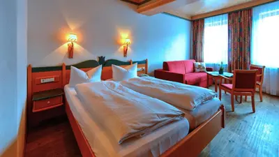 Ein Bett oder Betten in einem Zimmer der Unterkunft Gasthof zur Post