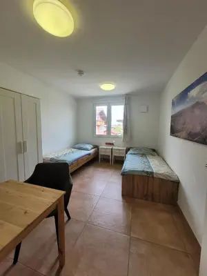 Ein Bett oder Betten in einem Zimmer der Unterkunft Pension Chen, 2 Doppelzimmer , EBK, separater Balkon