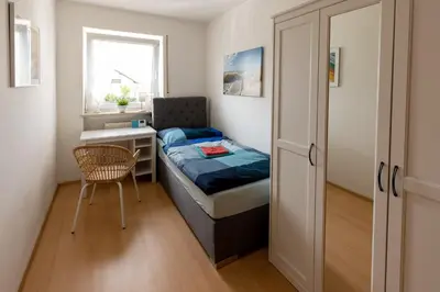 Ein Bett oder Betten in einem Zimmer der Unterkunft Ferienwohnung Chiemsee