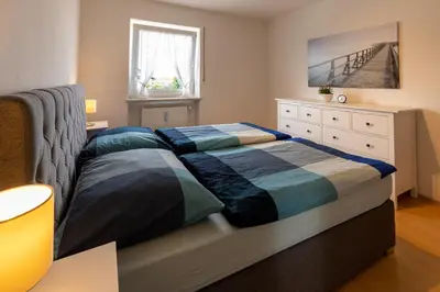 Ein Bett oder Betten in einem Zimmer der Unterkunft Ferienwohnung Chiemsee