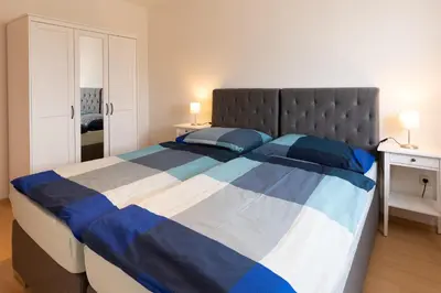 Ein Bett oder Betten in einem Zimmer der Unterkunft Ferienwohnung Chiemsee