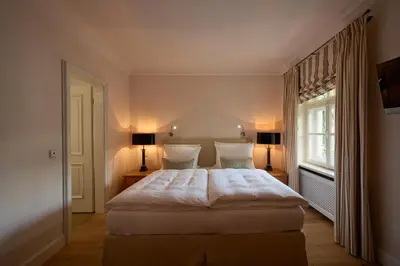 Ein Bett oder Betten in einem Zimmer der Unterkunft Brauereigasthof-Hotel Aying