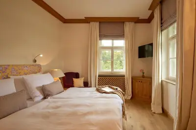 Ein Bett oder Betten in einem Zimmer der Unterkunft Brauereigasthof-Hotel Aying