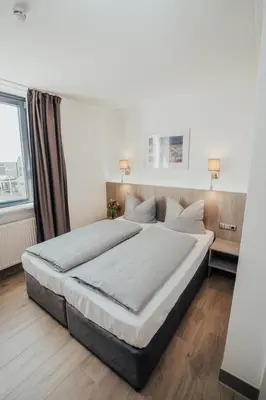 Ein Bett oder Betten in einem Zimmer der Unterkunft Lechpark Hotel