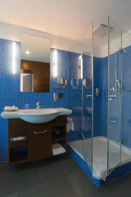 Ein Badezimmer in der Unterkunft Corbin München Airport Business Hotel