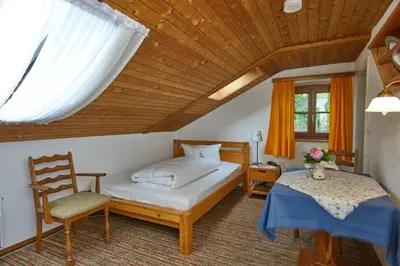 Ein Bett oder Betten in einem Zimmer der Unterkunft Alter Ziehbrunnen