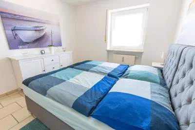 Ein Bett oder Betten in einem Zimmer der Unterkunft Ferienwohnung Salzburg