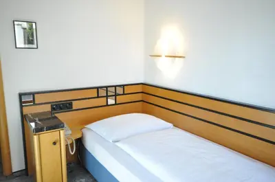Ein Bett oder Betten in einem Zimmer der Unterkunft Villa Waldperlach by Blattl