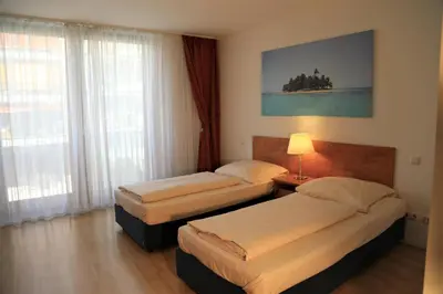 Ein Bett oder Betten in einem Zimmer der Unterkunft Hotel Christl München Innenstadt
