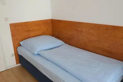 Ein Bett oder Betten in einem Zimmer der Unterkunft Hotel Christl München Innenstadt
