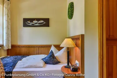 Ein Bett oder Betten in einem Zimmer der Unterkunft Hotel Oberwirt