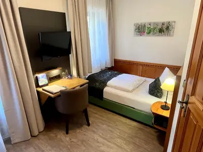 Ein Bett oder Betten in einem Zimmer der Unterkunft Hotel Oberwirt