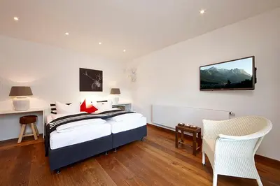 Ein Bett oder Betten in einem Zimmer der Unterkunft Hotel Föhrenhof