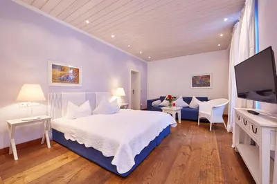 Ein Bett oder Betten in einem Zimmer der Unterkunft Hotel Föhrenhof