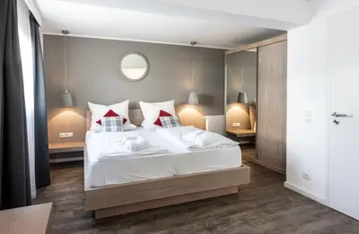 Ein Bett oder Betten in einem Zimmer der Unterkunft Karma Bavaria