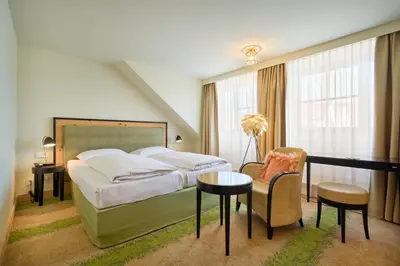 Ein Bett oder Betten in einem Zimmer der Unterkunft Hotel Lechnerhof Unterföhring