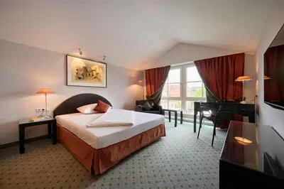 Ein Bett oder Betten in einem Zimmer der Unterkunft Hotel Lechnerhof Unterföhring