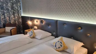 Ein Bett oder Betten in einem Zimmer der Unterkunft Hotel Lechnerhof Unterföhring