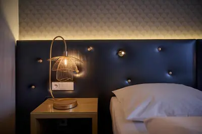 Ein Bett oder Betten in einem Zimmer der Unterkunft Hotel Lechnerhof Unterföhring