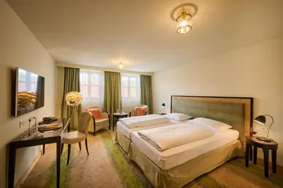Ein Bett oder Betten in einem Zimmer der Unterkunft Hotel Lechnerhof Unterföhring