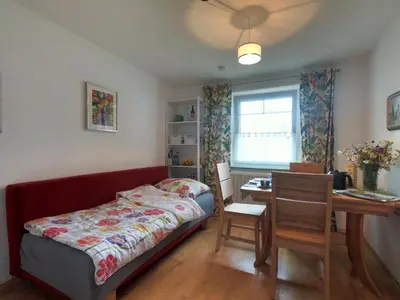 Ein Bett oder Betten in einem Zimmer der Unterkunft Ferienwohnung Vroni