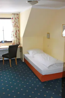 Ein Bett oder Betten in einem Zimmer der Unterkunft ARRIVEL Hotel am Bergson - bisher Hotel Neuner
