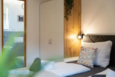 Ein Bett oder Betten in einem Zimmer der Unterkunft Ferienwohnung Wendelstein