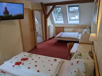 Ein Bett oder Betten in einem Zimmer der Unterkunft Gasthof Adler