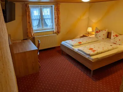 Ein Bett oder Betten in einem Zimmer der Unterkunft Gasthof Adler