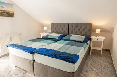 Ein Bett oder Betten in einem Zimmer der Unterkunft Ferienwohnung Burghausen