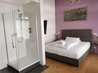 Ein Bett oder Betten in einem Zimmer der Unterkunft Altstadthotel Bachbräu