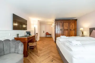 Ein Bett oder Betten in einem Zimmer der Unterkunft Altstadthotel Bachbräu