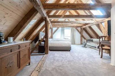 Ein Bett oder Betten in einem Zimmer der Unterkunft Altstadthotel Bachbräu