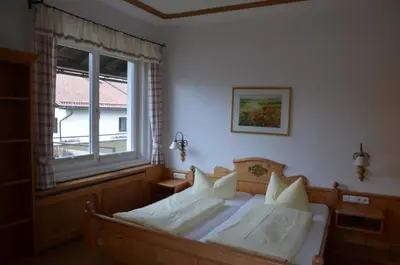 Ein Bett oder Betten in einem Zimmer der Unterkunft Gästehaus Maria