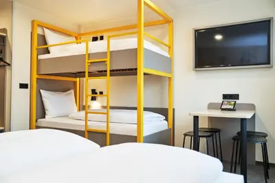 Ein Bett oder Betten in einem Zimmer der Unterkunft McDreams Hotel München-Nord