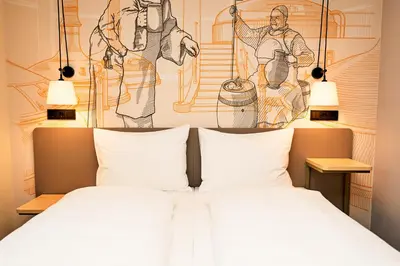 Ein Bett oder Betten in einem Zimmer der Unterkunft McDreams Hotel München-Nord