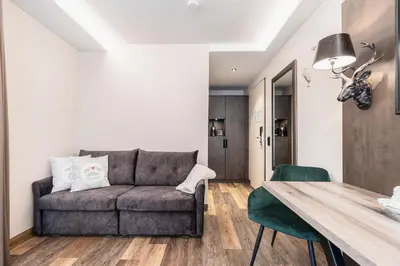 Ein Sitzbereich in der Unterkunft Hotel Demas München-Unterhaching