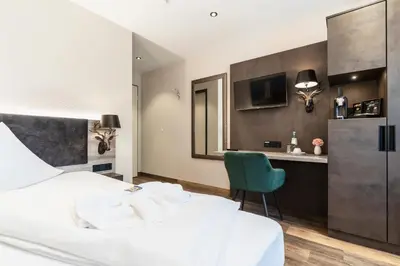 Ein Bett oder Betten in einem Zimmer der Unterkunft Hotel Demas München-Unterhaching