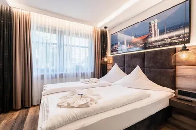 Ein Bett oder Betten in einem Zimmer der Unterkunft Hotel Demas München-Unterhaching