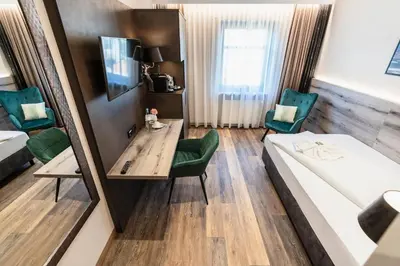 Ein Bett oder Betten in einem Zimmer der Unterkunft Hotel Demas München-Unterhaching