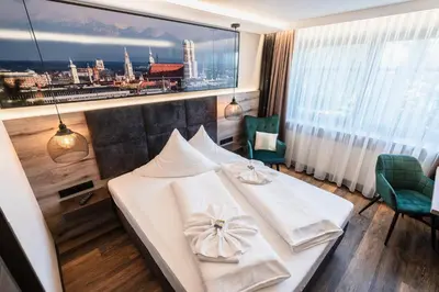 Ein Bett oder Betten in einem Zimmer der Unterkunft Hotel Demas München-Unterhaching