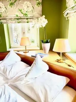 Ein Bett oder Betten in einem Zimmer der Unterkunft Hotel Fischerhaus