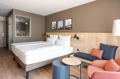 Ein Bett oder Betten in einem Zimmer der Unterkunft aja Garmisch-Partenkirchen